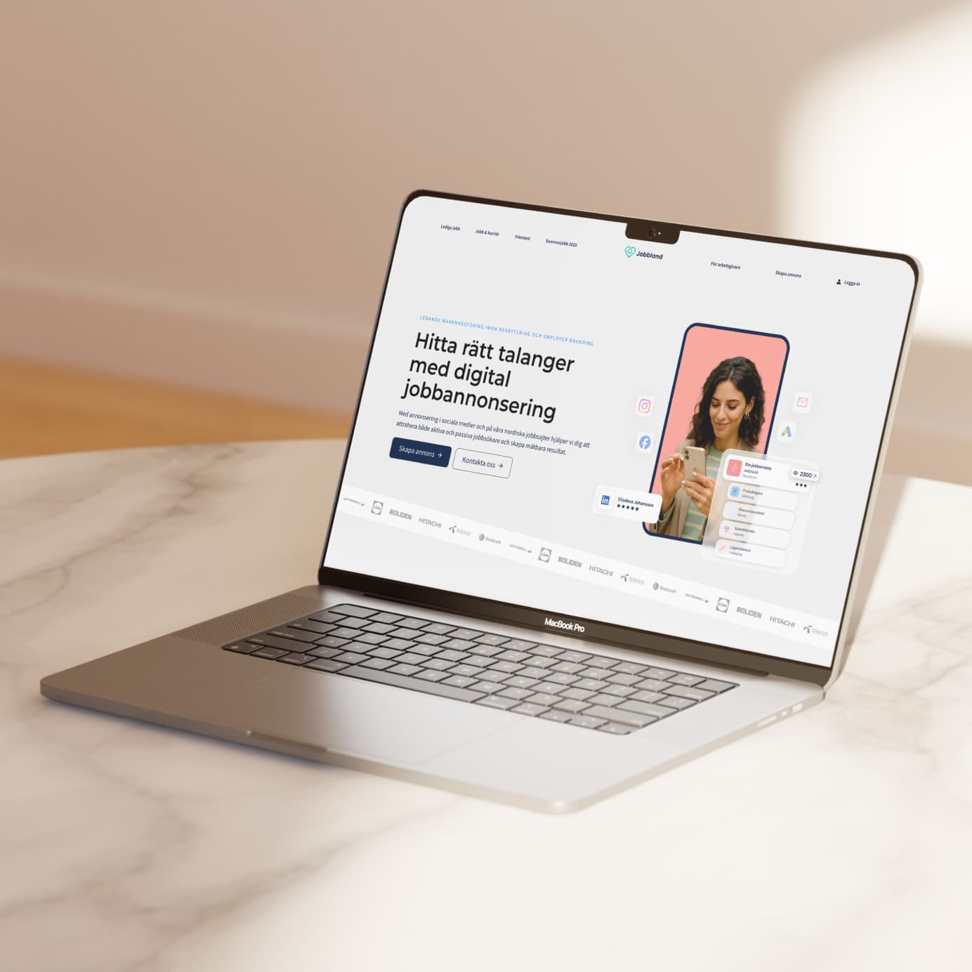 Jobbland recruitment website on a laptop, with a job advertising headline and mobile campaign preview.