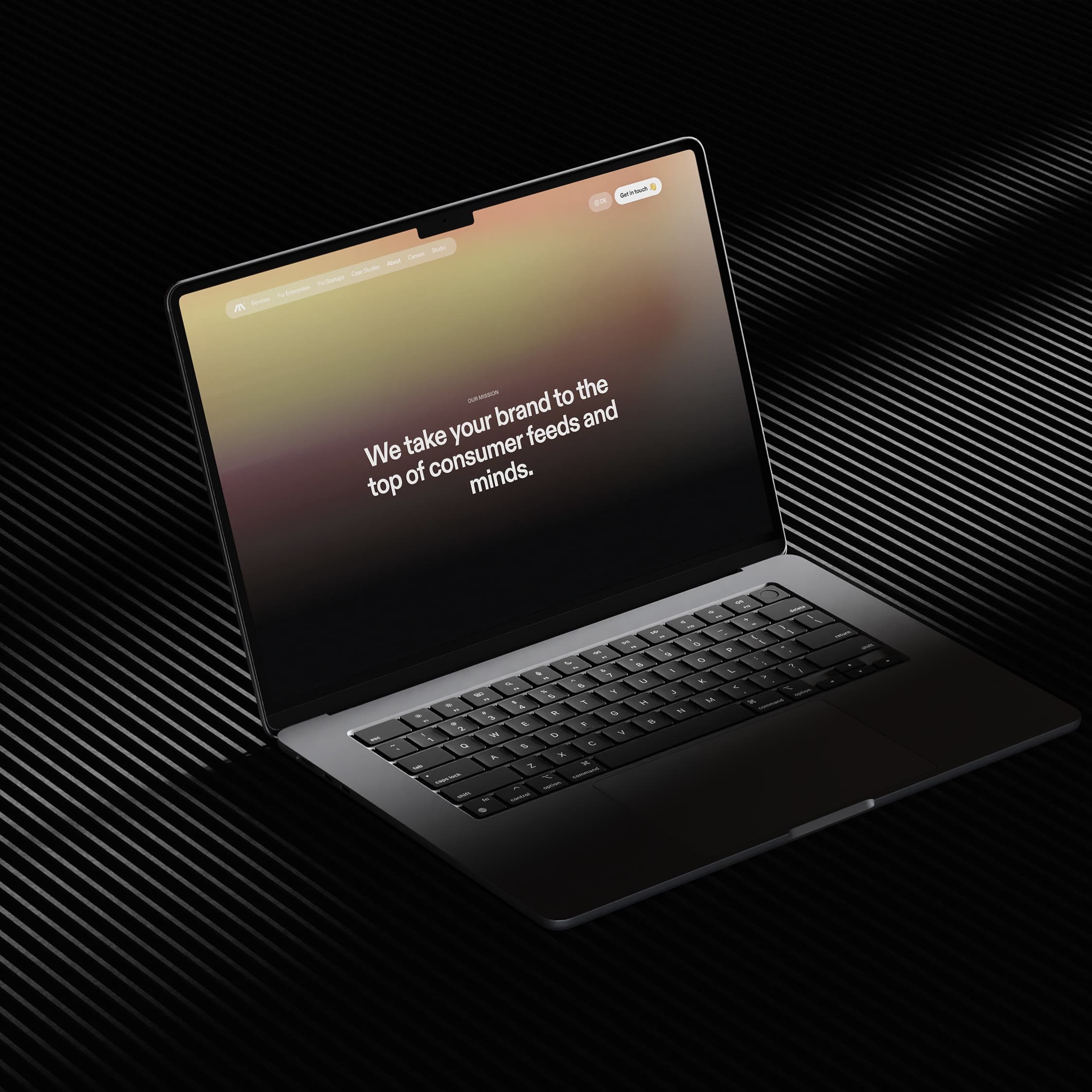 Laptop displaying Moonbase's gradient homepage and brand positioning message.